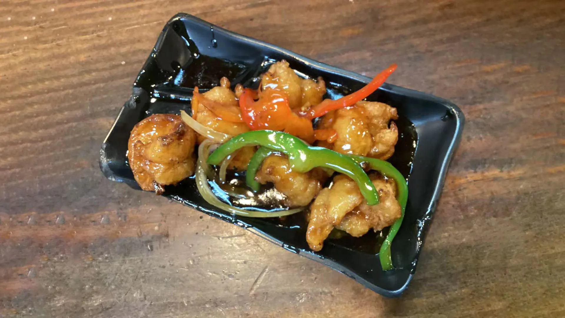 Six crispy honey teriyaki glazed shrimp with green peppers at Noodle Man，a Chinese Restaurant in Virginia Beach